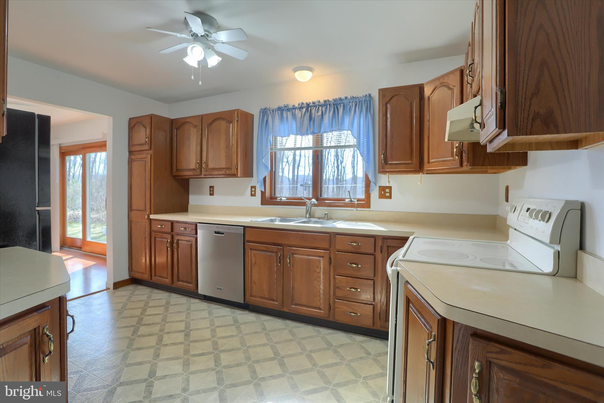 149 Stone Mountain Road Pine Grove, PA 17963 - Photo 22 of 64 a kitchen with a sink window and cabinets