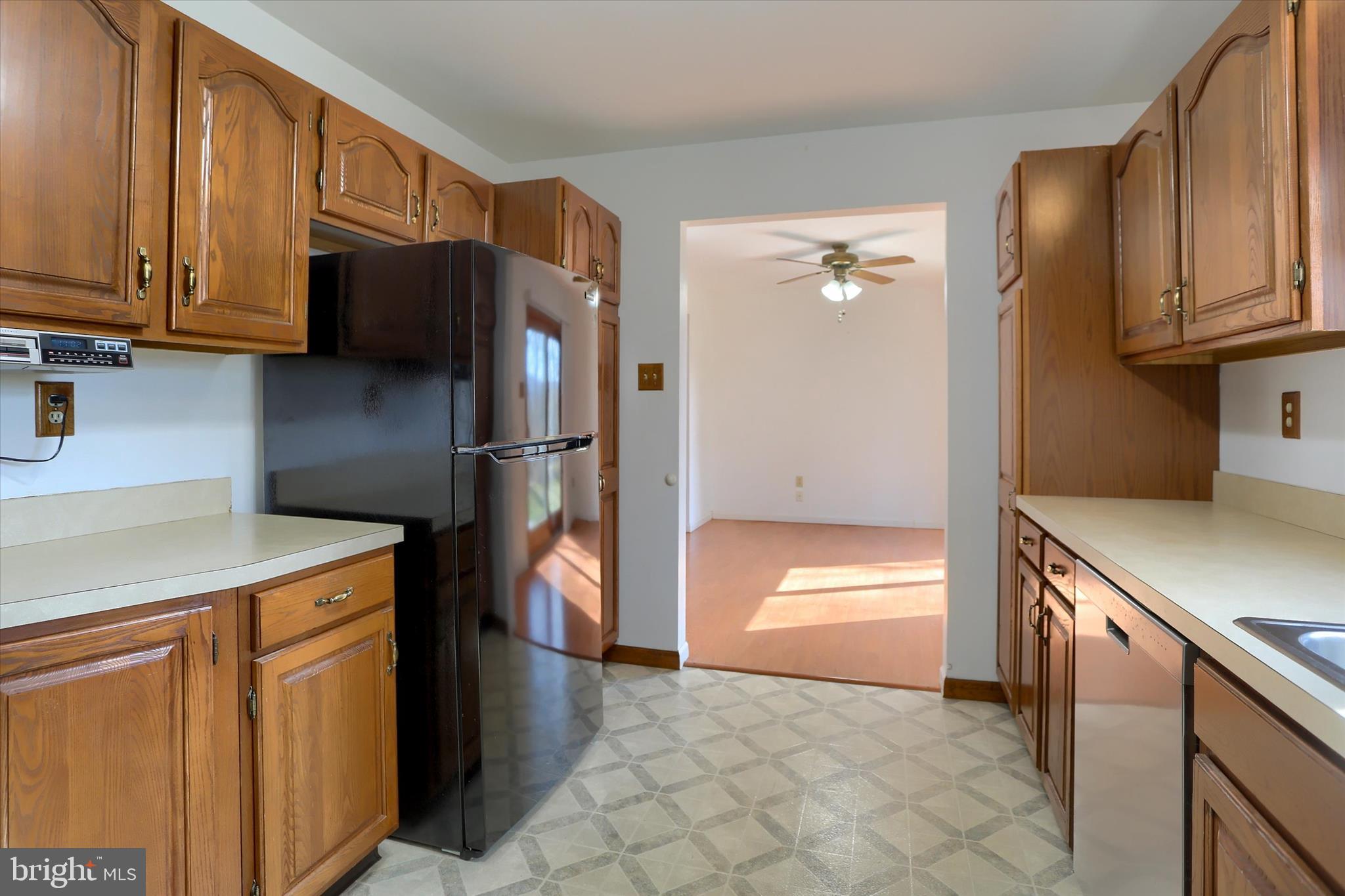 149 Stone Mountain Road Pine Grove, PA 17963 - Photo 24 of 64 a kitchen with stainless steel appliances granite countertop a refrigerator a stove and a sink