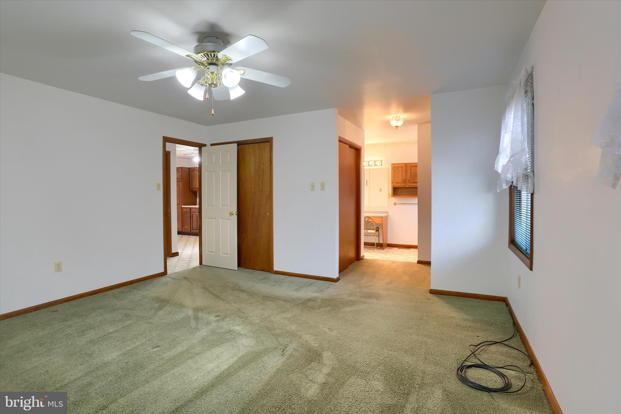 149 Stone Mountain Road Pine Grove, PA 17963 - Photo 28 of 64 a view of an empty room with window and chandelier fan
