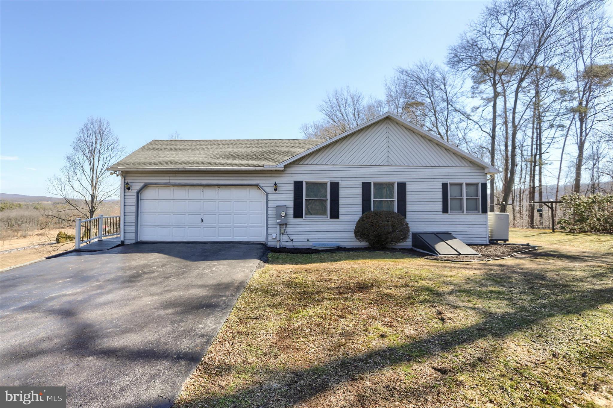 149 Stone Mountain Road Pine Grove, PA 17963 - Photo 54 of 64 a front view of a house with a yard and garage