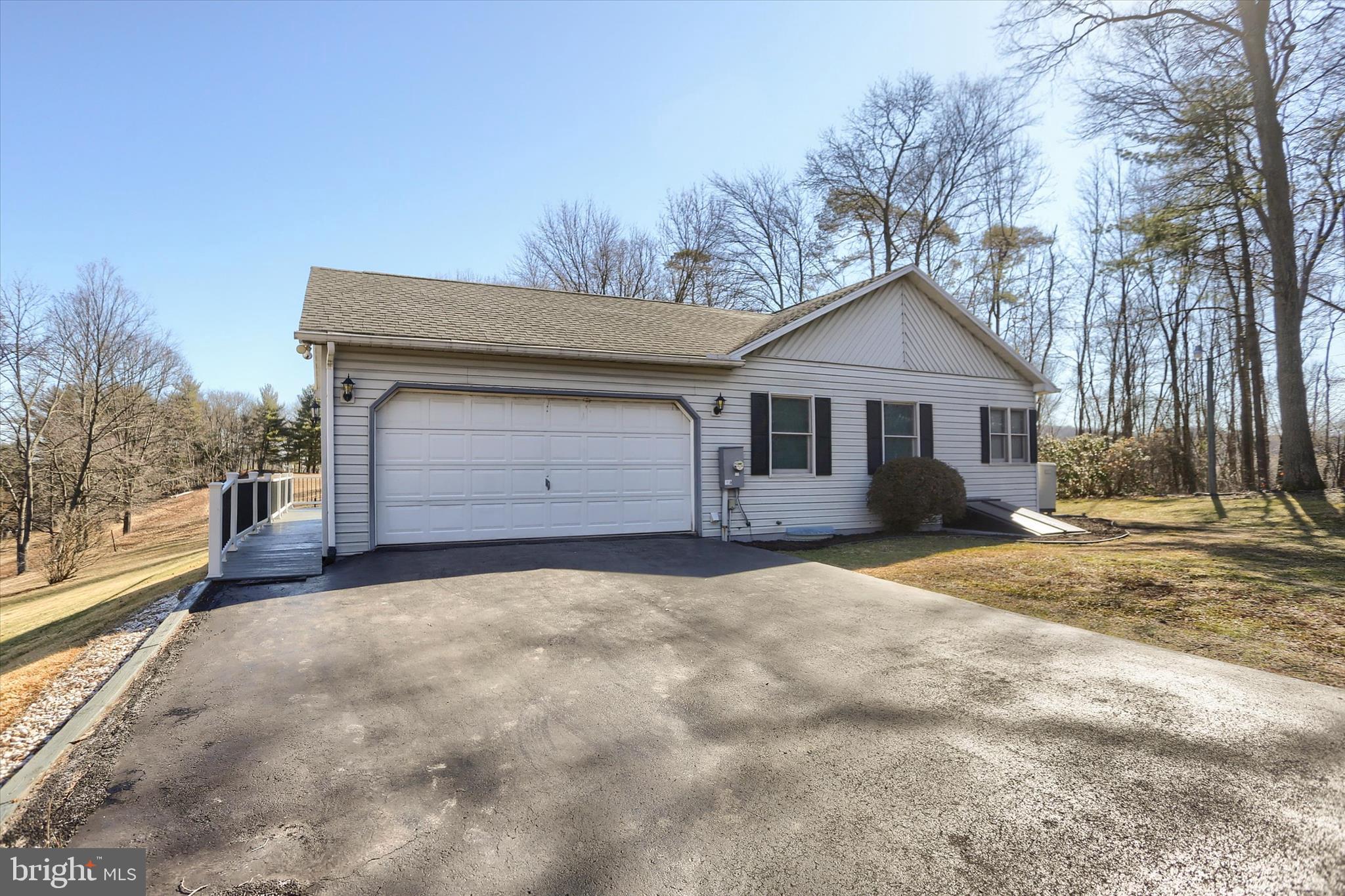 149 Stone Mountain Road Pine Grove, PA 17963 - Photo 55 of 64 a front view of a house with a yard and garage