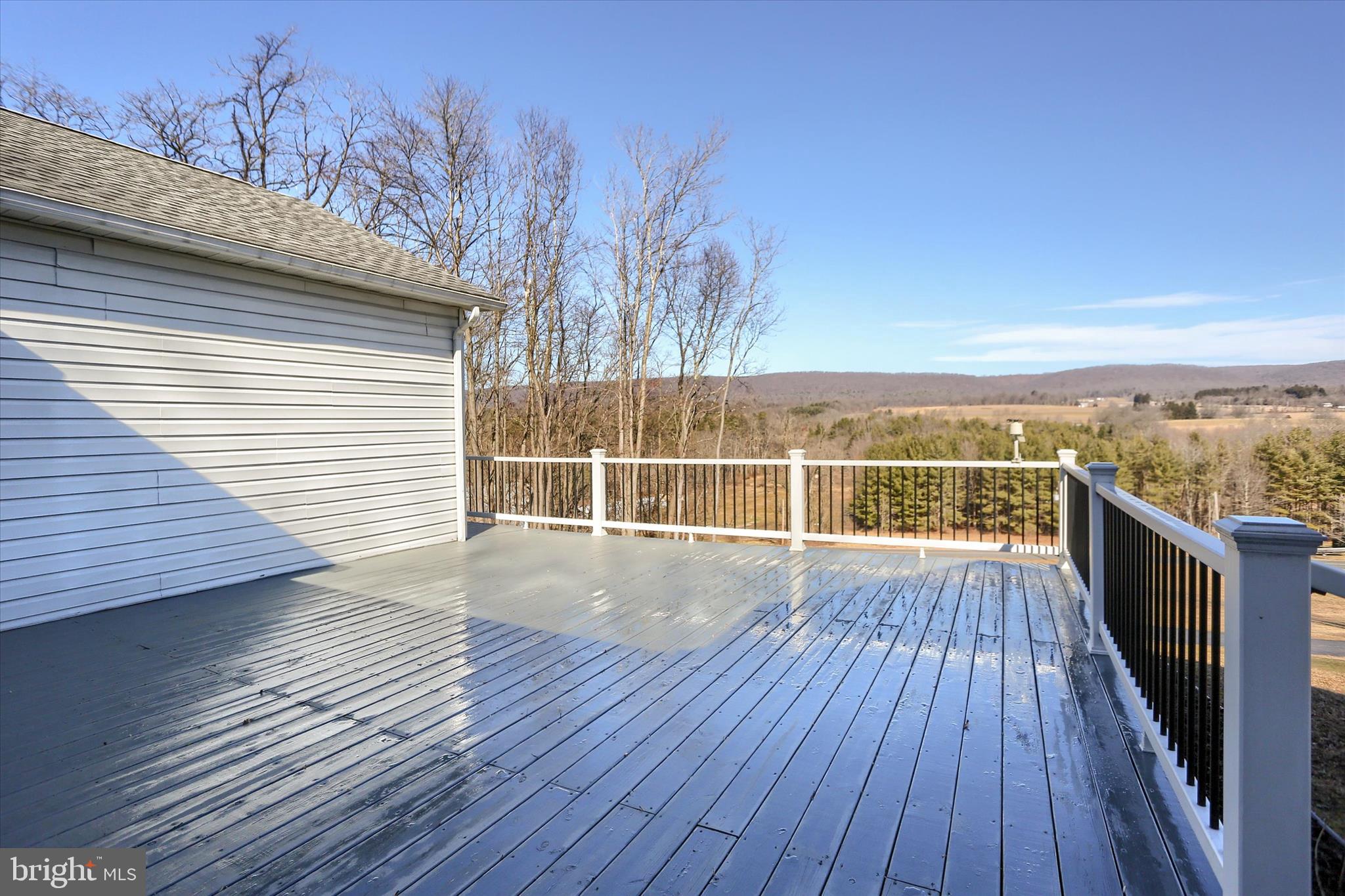 149 Stone Mountain Road Pine Grove, PA 17963 - Photo 7 of 64 a view of a balcony with wooden floor and fence