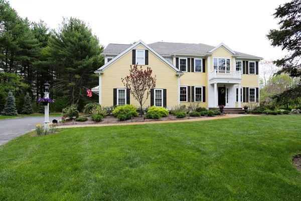4 Marked Tree Road Sudbury, MA 01776 - Photo 1 of 27 a front view of a house with a yard table and chairs