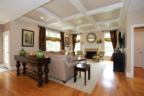 4 Marked Tree Road Sudbury, MA 01776 - Photo 12 of 27 a living room with furniture a fireplace and a large window