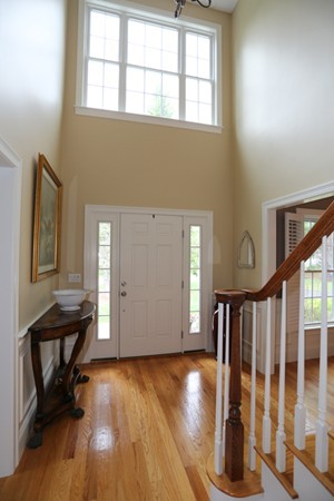 4 Marked Tree Road Sudbury, MA 01776 - Photo 2 of 27 a view of entryway with wooden floor and stairs