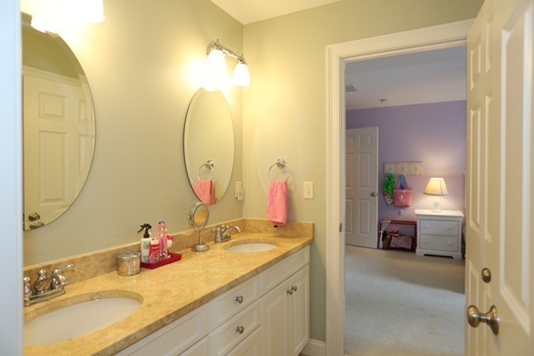 4 Marked Tree Road Sudbury, MA 01776 - Photo 21 of 27 a en suite bathroom with a double vanity sink and a mirror