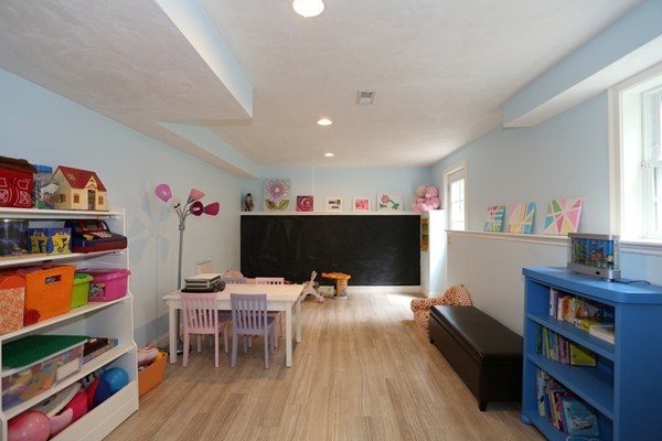 4 Marked Tree Road Sudbury, MA 01776 - Photo 23 of 27 a living room with furniture and a wooden floor