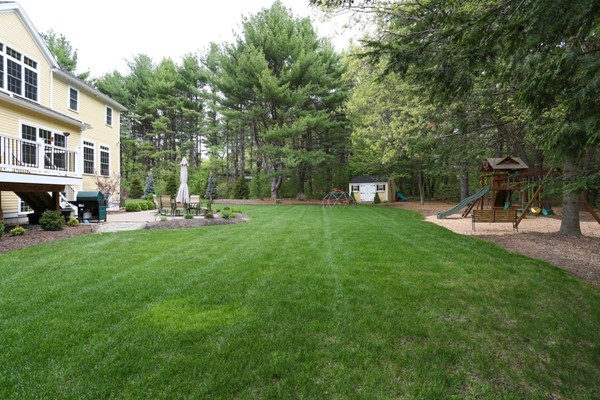 4 Marked Tree Road Sudbury, MA 01776 - Photo 25 of 27 a view of a house with a backyard