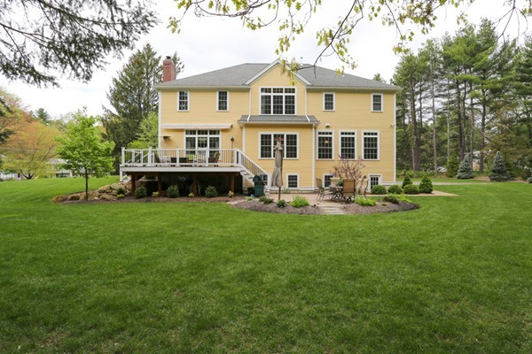 4 Marked Tree Road Sudbury, MA 01776 - Photo 27 of 27 a front view of a house with a garden and trees
