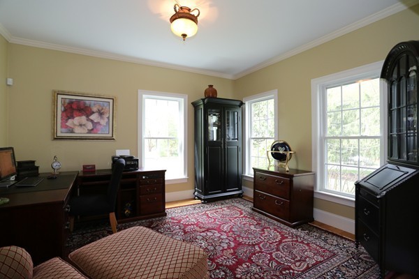 4 Marked Tree Road Sudbury, MA 01776 - Photo 3 of 27 a bedroom with a bed and wooden floor