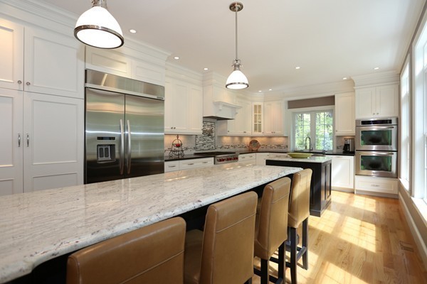 4 Marked Tree Road Sudbury, MA 01776 - Photo 8 of 27 a kitchen with stainless steel appliances granite countertop a sink a stove and a wooden floors