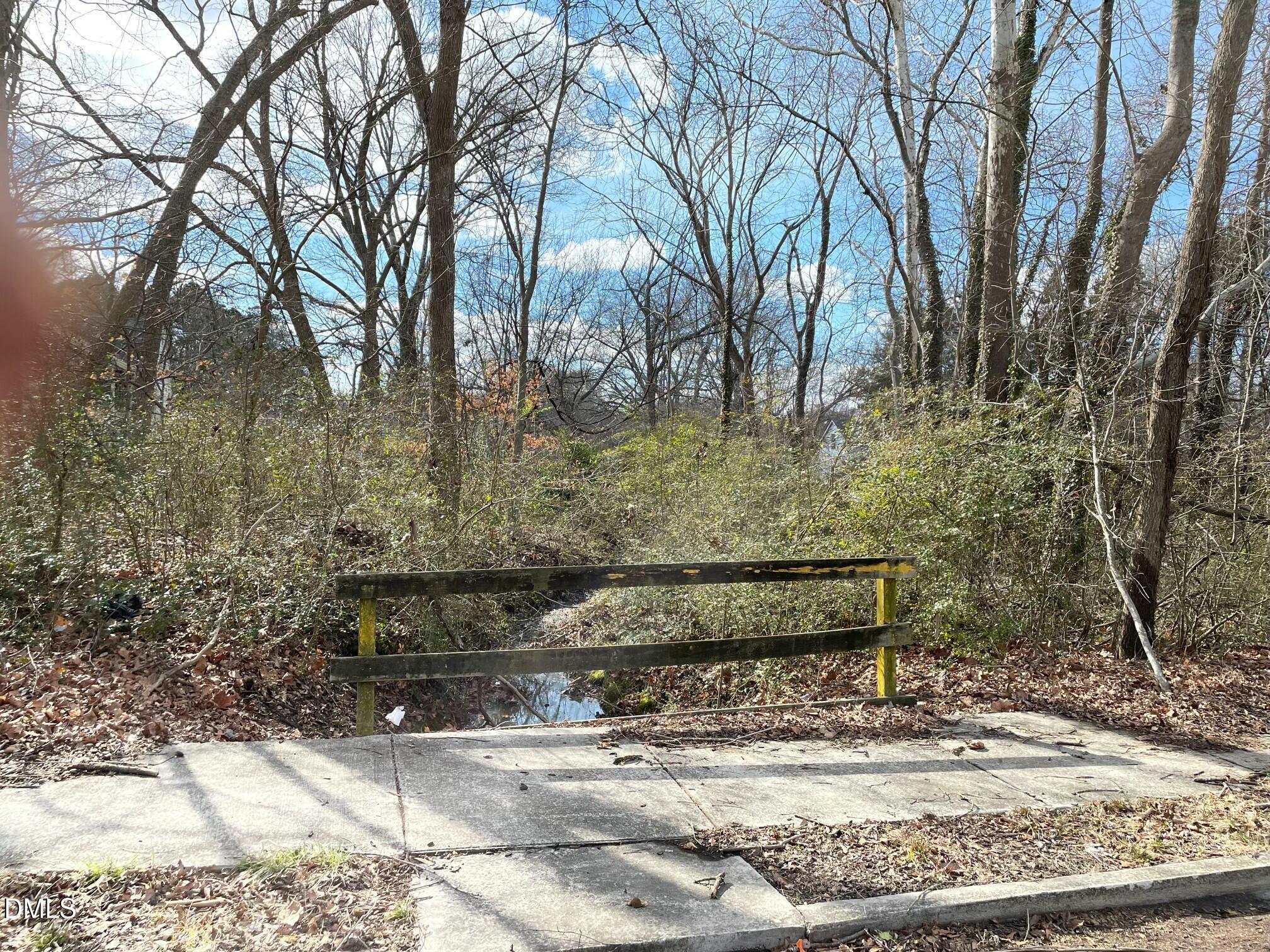 375 West Rockspring Street Henderson, NC 27536 - Photo 3 of 5 a view of a bench in a backyard
