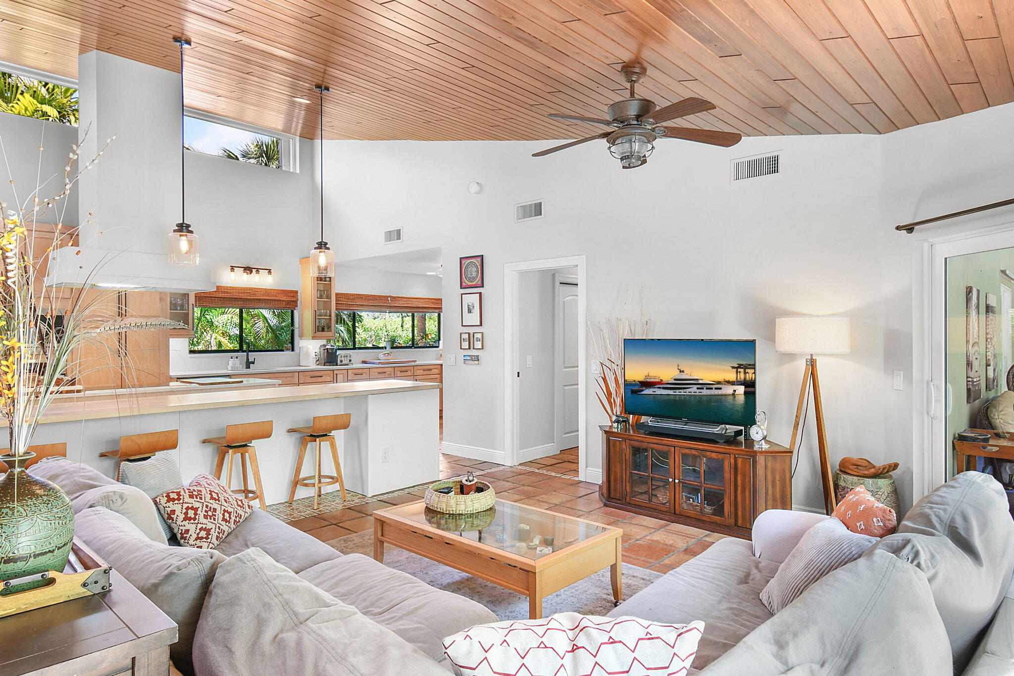 1 Riverview Drive Sewall's Point, FL 34996 - Photo 20 of 70 a living room with furniture a flat screen tv and a table