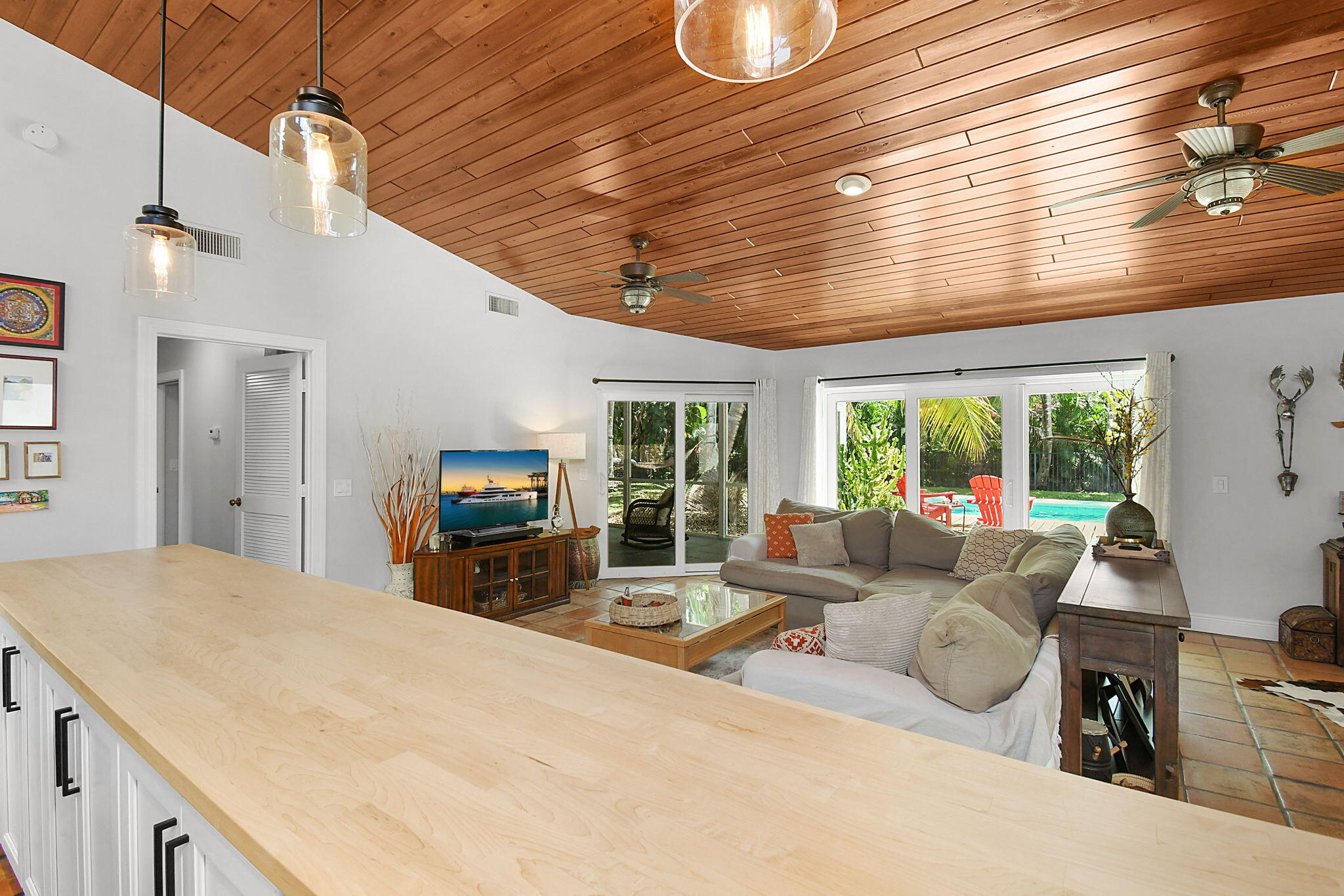 1 Riverview Drive Sewall's Point, FL 34996 - Photo 26 of 70 a living room with furniture large window and flat screen tv