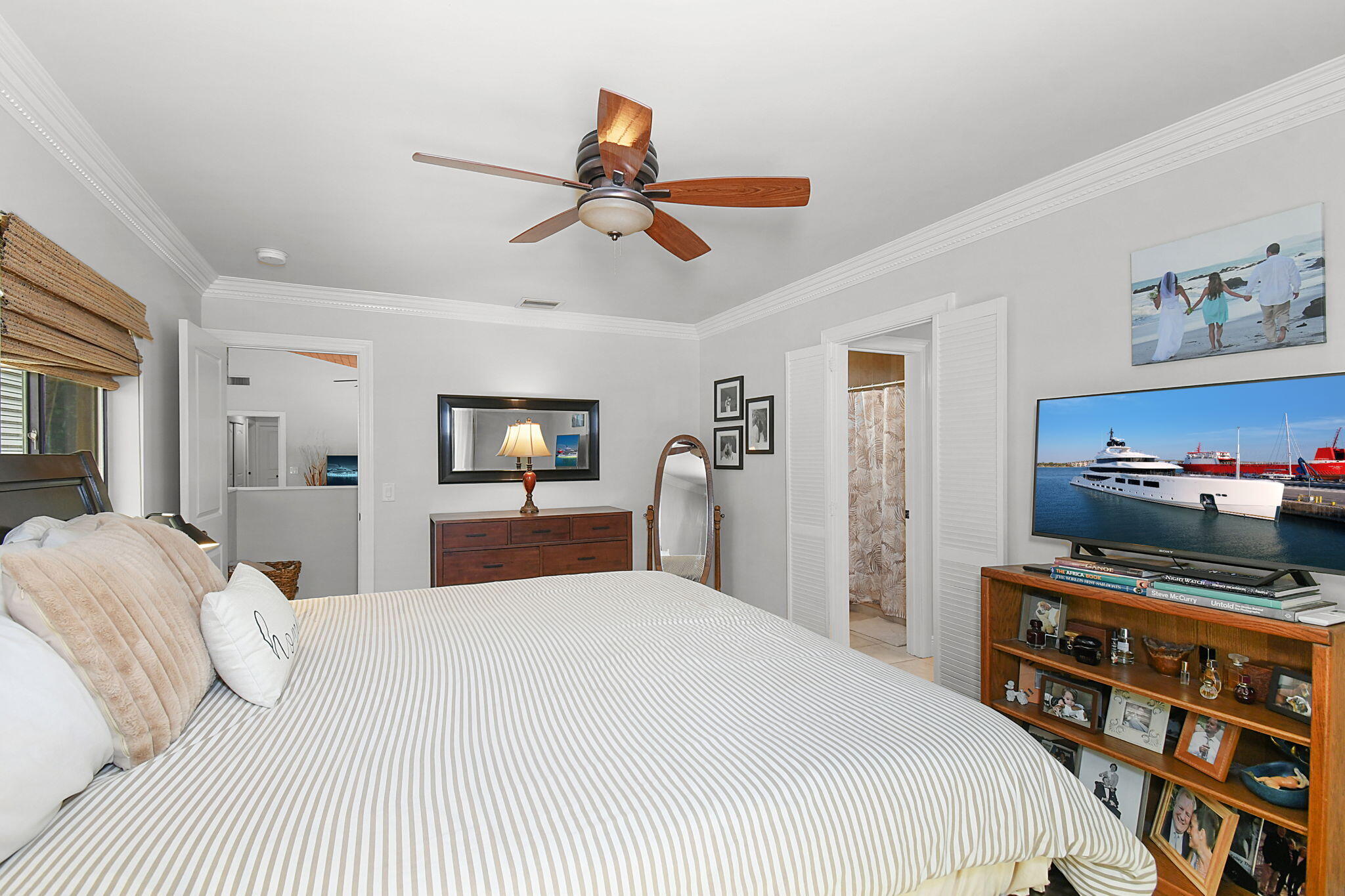 1 Riverview Drive Sewall's Point, FL 34996 - Photo 28 of 70 a bedroom with a bed and a flat screen tv