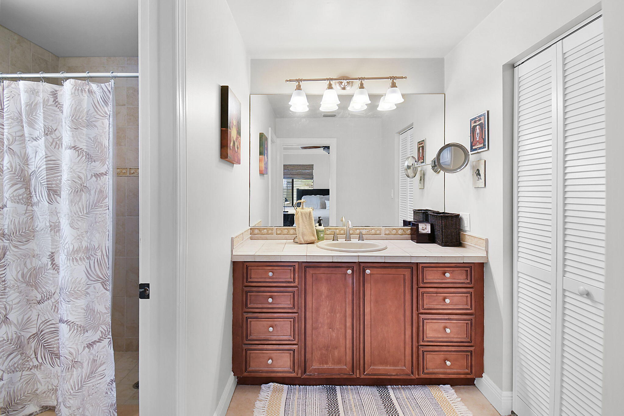 1 Riverview Drive Sewall's Point, FL 34996 - Photo 29 of 70 a spacious bathroom with a granite countertop sink a mirror and a