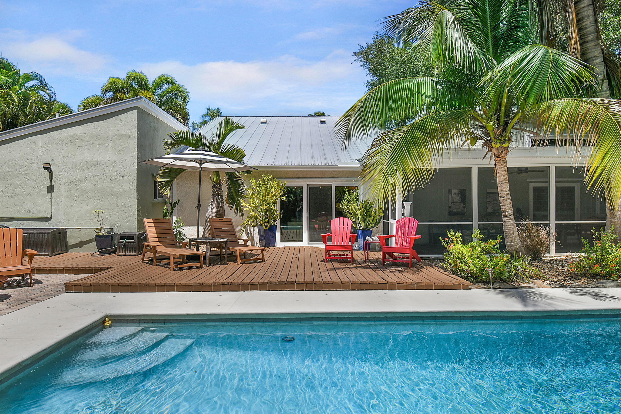1 Riverview Drive Sewall's Point, FL 34996 - Photo 3 of 70 a view of a house with backyard porch and sitting area