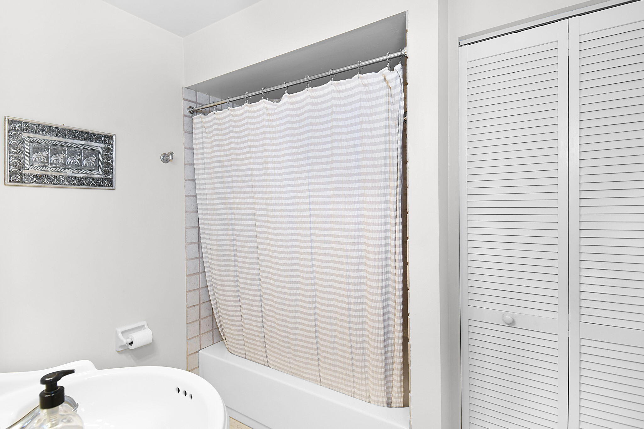 1 Riverview Drive Sewall's Point, FL 34996 - Photo 34 of 70 a bathroom with a toilet a sink and shower