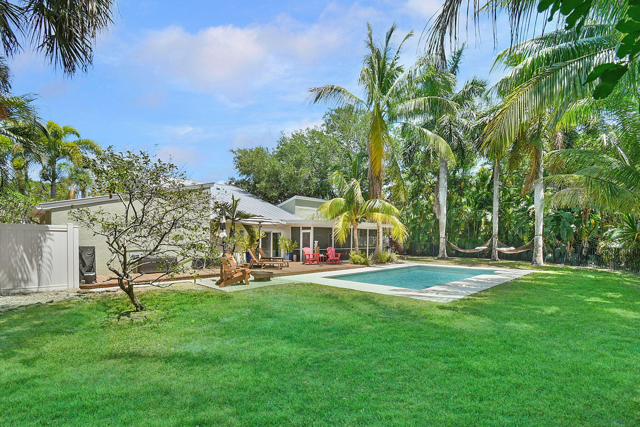 1 Riverview Drive Sewall's Point, FL 34996 - Photo 45 of 70 a front view of a house with a yard and trees