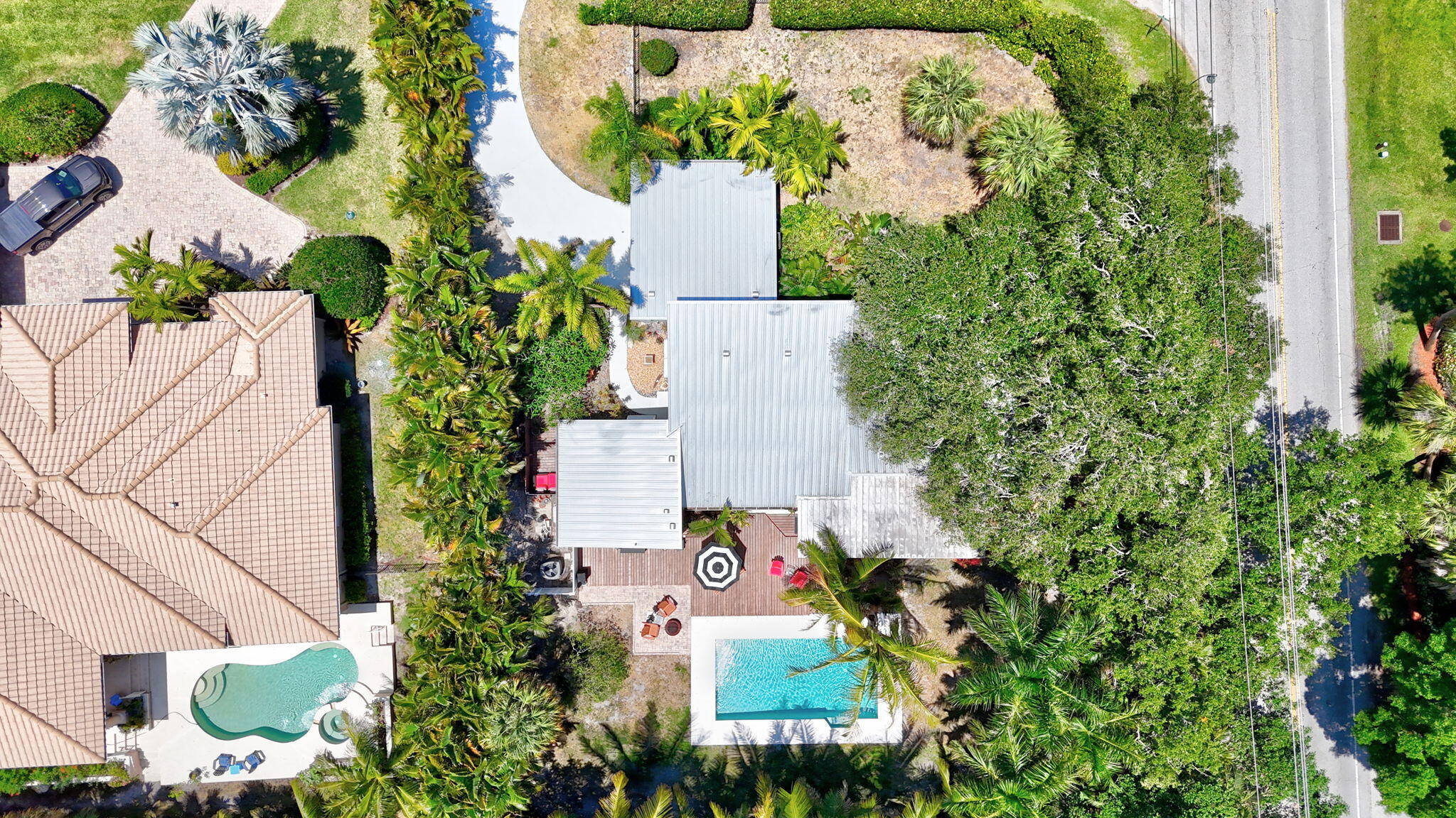 1 Riverview Drive Sewall's Point, FL 34996 - Photo 63 of 70 an aerial view of a house with a yard and garden