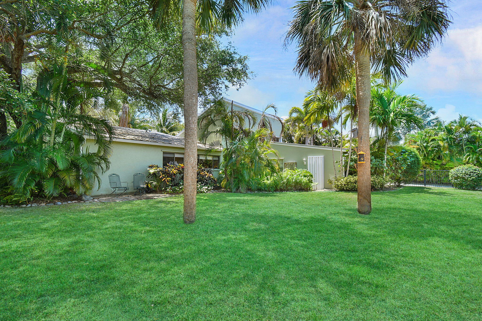 1 Riverview Drive Sewall's Point, FL 34996 - Photo 8 of 70 a house with palm tree in front of it