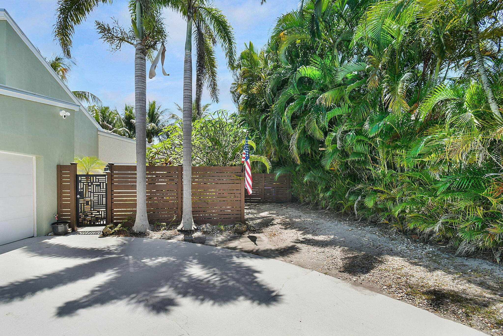 1 Riverview Drive Sewall's Point, FL 34996 - Photo 9 of 70 a view of a house with a yard and garage