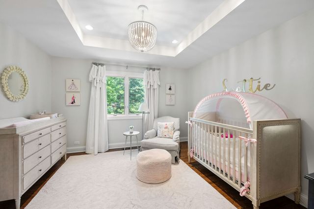 a bedroom with furniture and windows