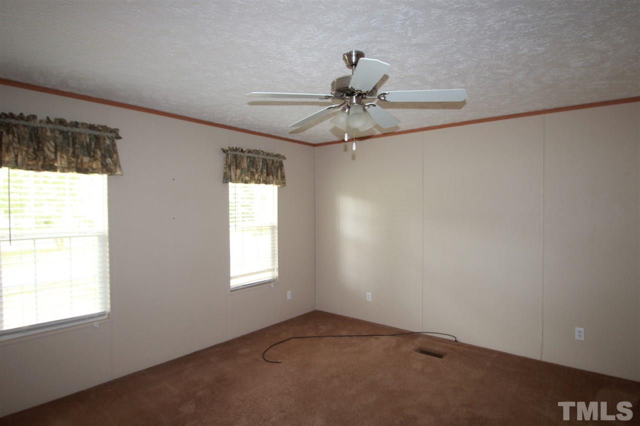 11973 Virgilina Road Roxboro, NC 27574 - Photo 5 of 10 a view of a window in an empty room