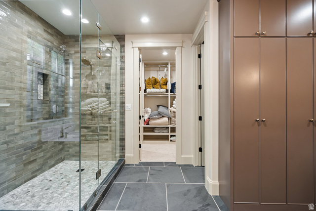 1141 South Oak Leaf Lane Springville, UT 84663 - Photo 61 of 147 Glass-enclosed shower featuring a tiled bench and a pebbled floor