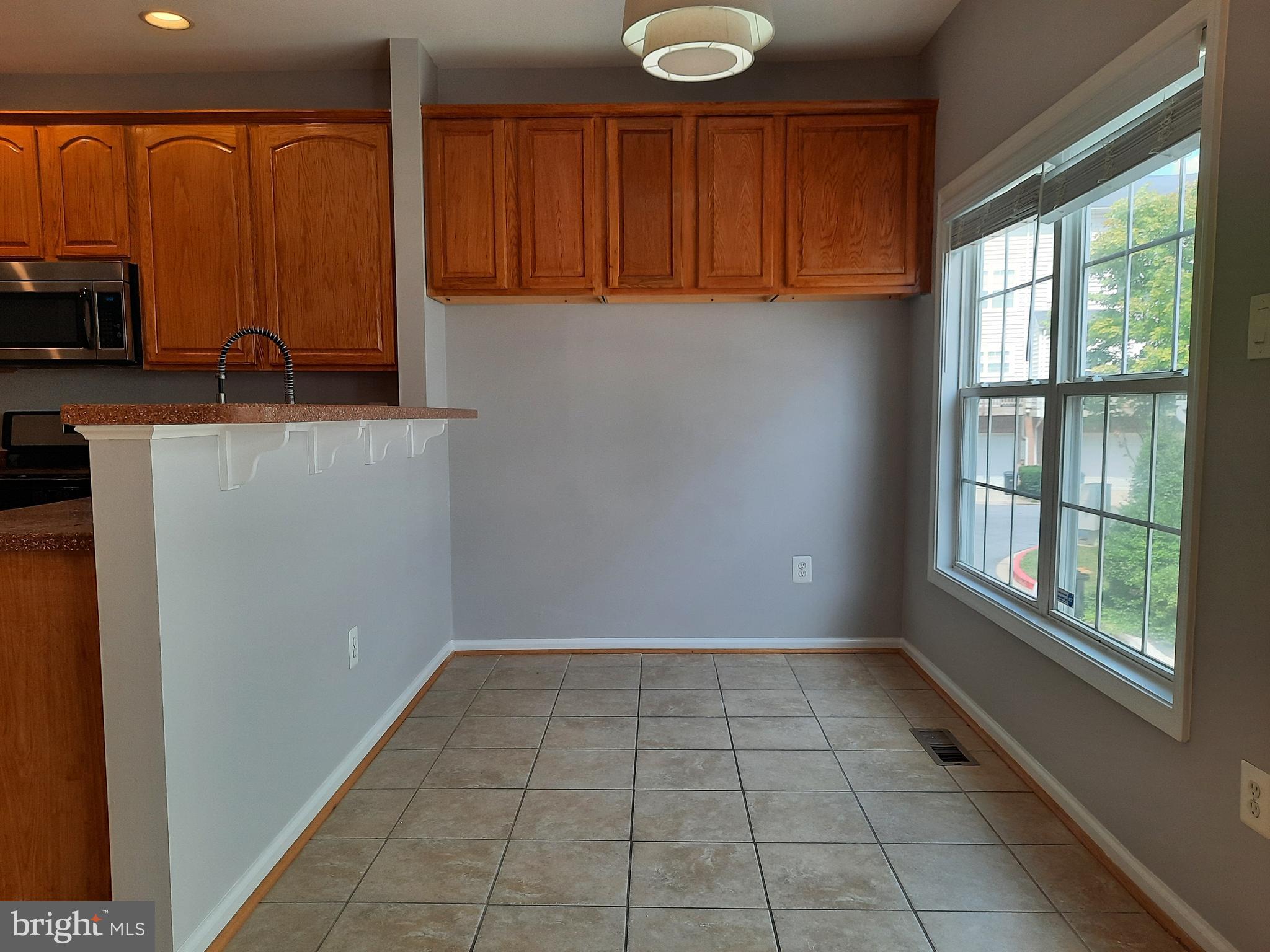 10258 Rutland Round Road, Unit 13 Columbia, MD 21044 - Photo 12 of 46 a view of an empty room with a window