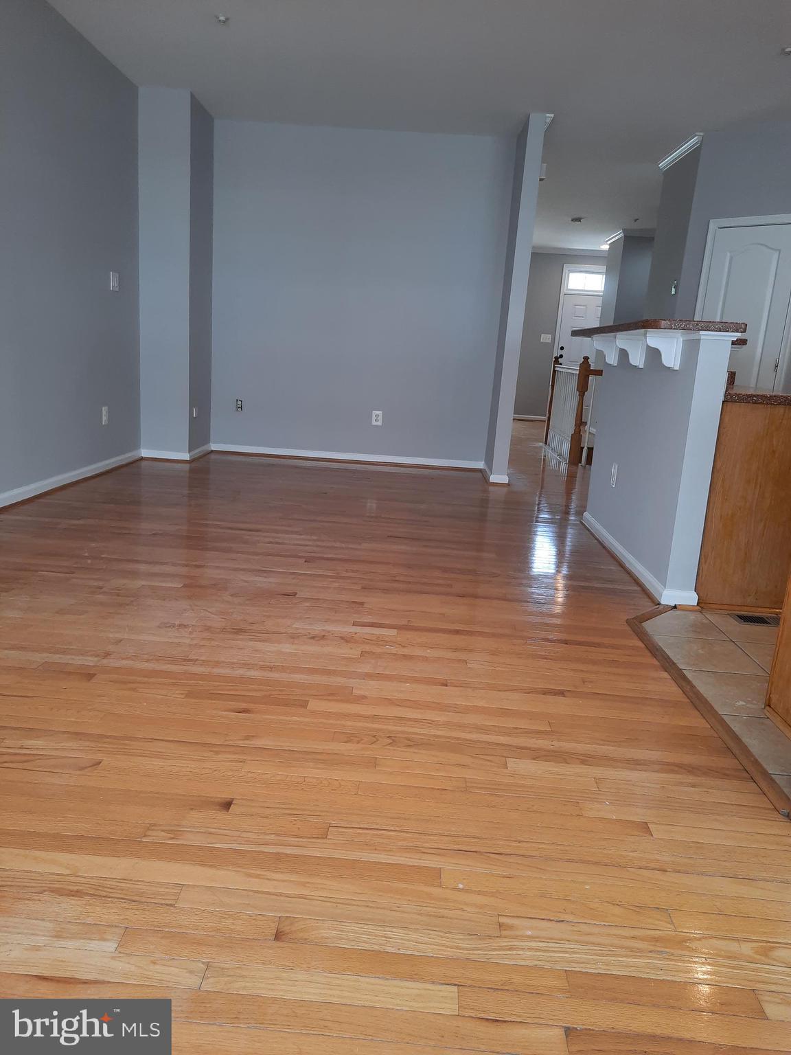 10258 Rutland Round Road, Unit 13 Columbia, MD 21044 - Photo 13 of 46 a view of room and wooden floor