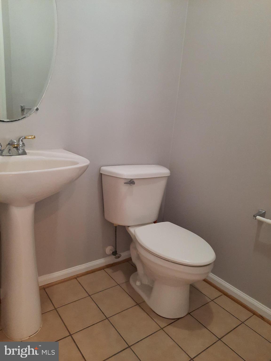 10258 Rutland Round Road, Unit 13 Columbia, MD 21044 - Photo 16 of 46 a bathroom with a toilet and a sink