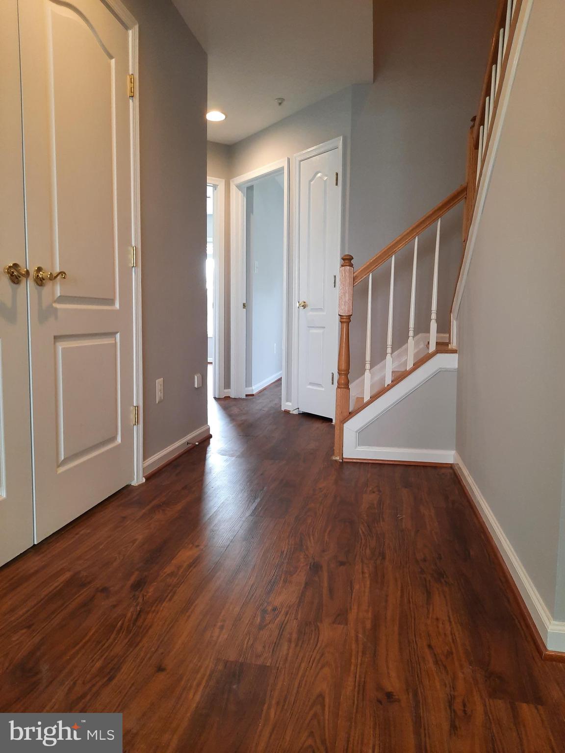 10258 Rutland Round Road, Unit 13 Columbia, MD 21044 - Photo 18 of 46 wooden floor in a hall with an entryway and wooden floor