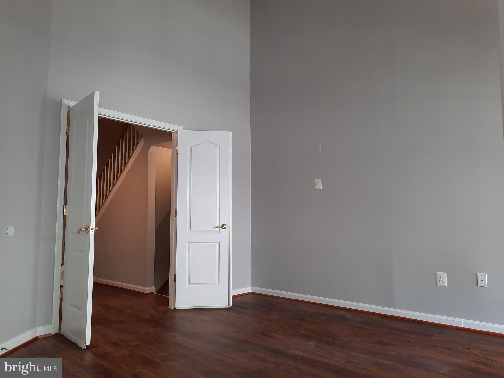10258 Rutland Round Road, Unit 13 Columbia, MD 21044 - Photo 20 of 46 a view of an empty room with wooden floor