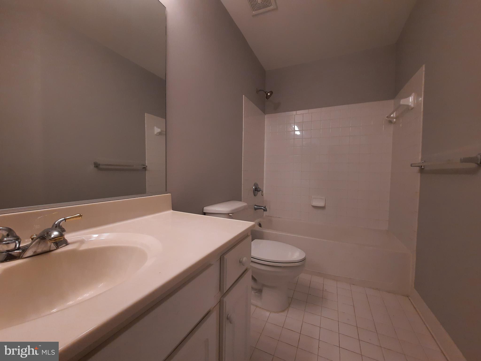 10258 Rutland Round Road, Unit 13 Columbia, MD 21044 - Photo 29 of 46 a bathroom with a sink toilet and shower