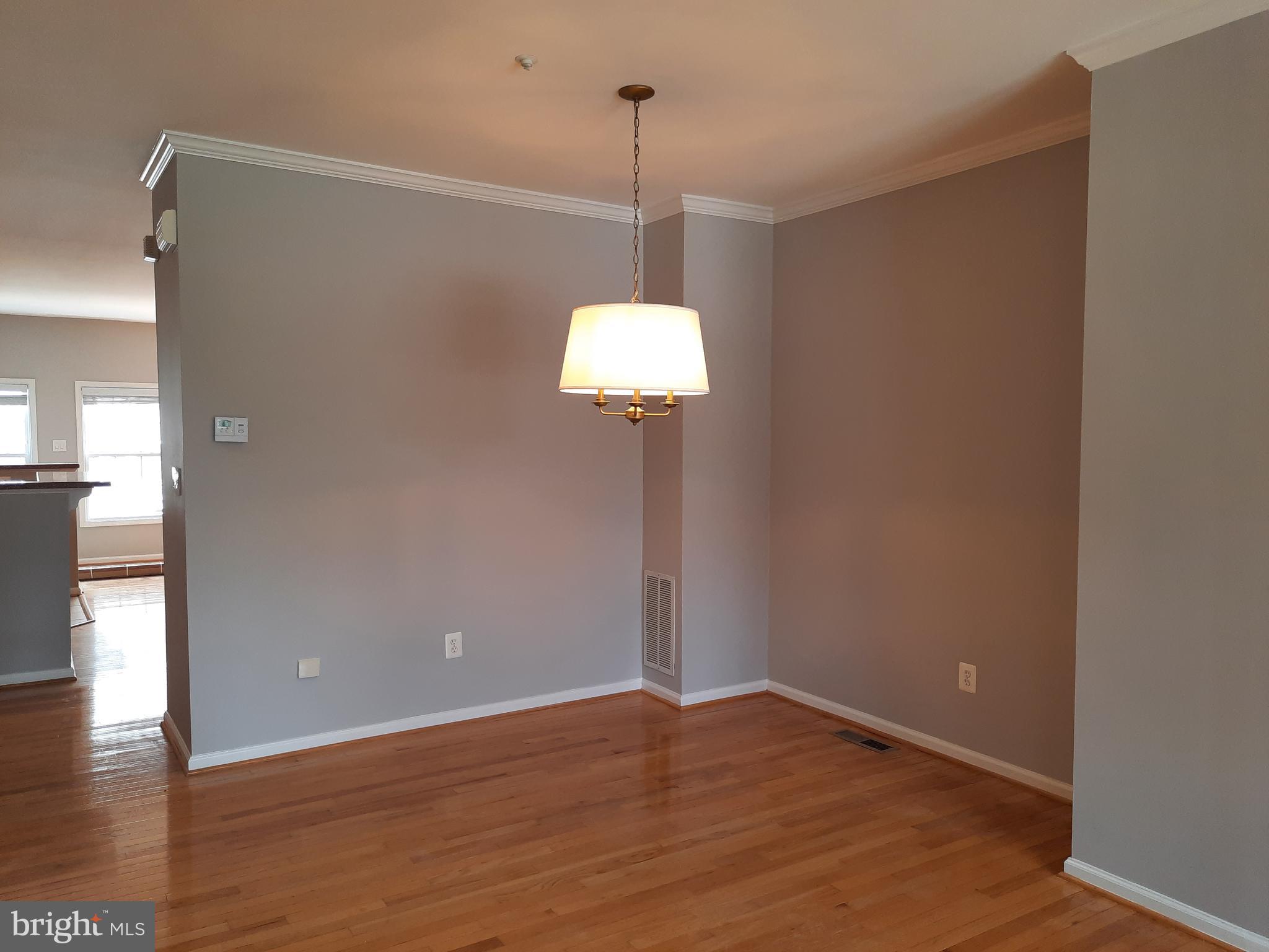 10258 Rutland Round Road, Unit 13 Columbia, MD 21044 - Photo 6 of 46 a view of a room with wooden floor and window