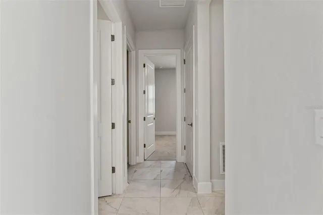 a living room with furniture kitchen view and a dining table
