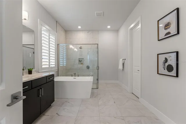 a living room with furniture and a ceiling fan