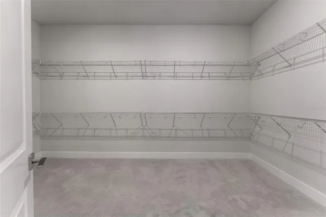 a view of a house with a backyard and a patio