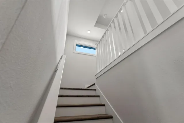 an aerial view of residential houses with outdoor space and swimming pool