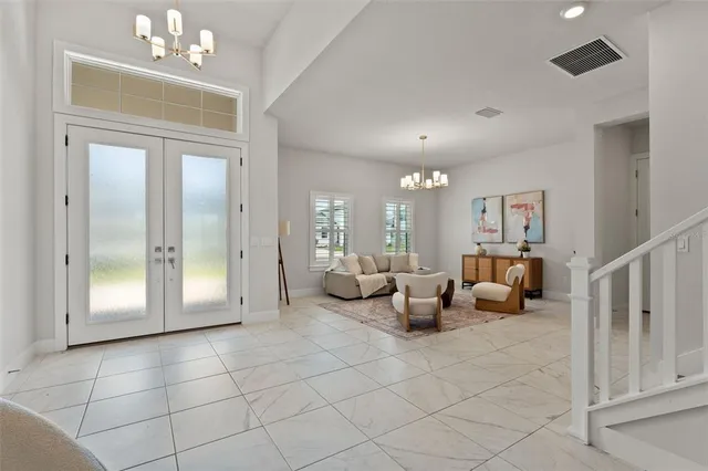 an empty room with a window and a ceiling fan