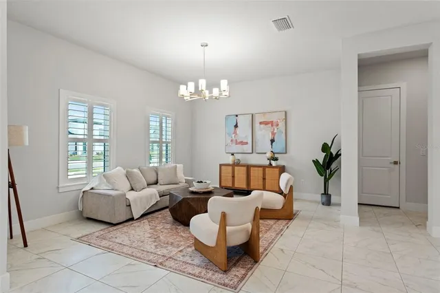 a living room with furniture and a large window