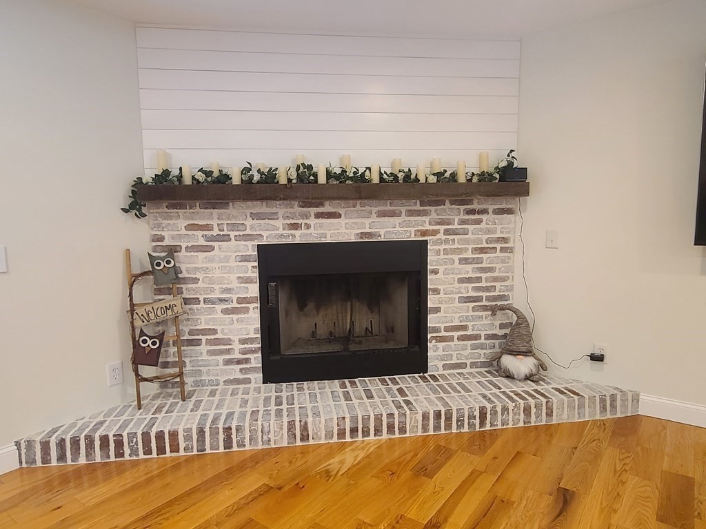 123 Boston Road Palmer, MA 01069 - Photo 12 of 33 a living room with a fireplace