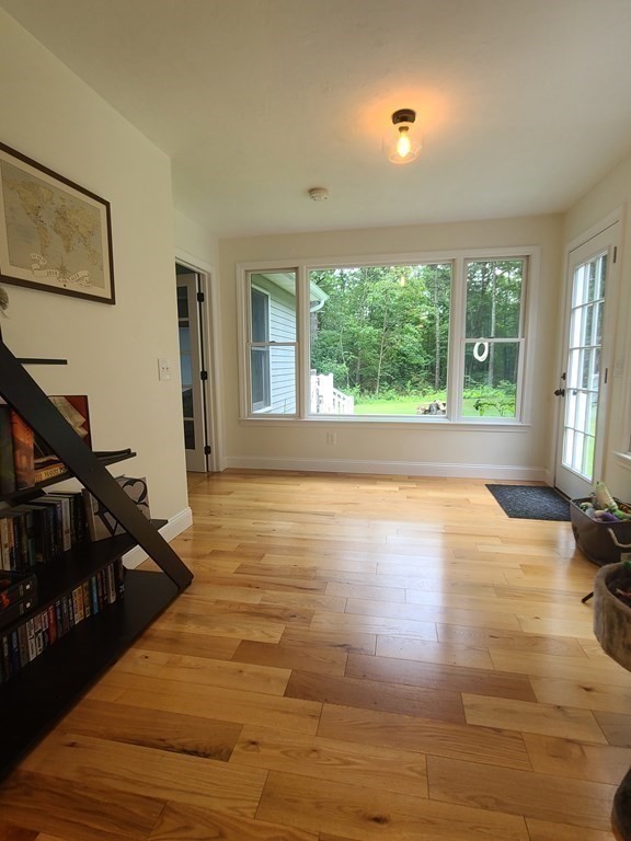 123 Boston Road Palmer, MA 01069 - Photo 13 of 33 a view of empty room with wooden floor and fan