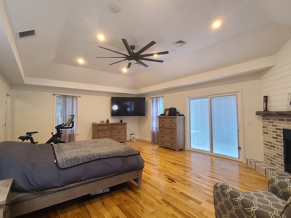 123 Boston Road Palmer, MA 01069 - Photo 14 of 33 a spacious bedroom with a bed and a couch