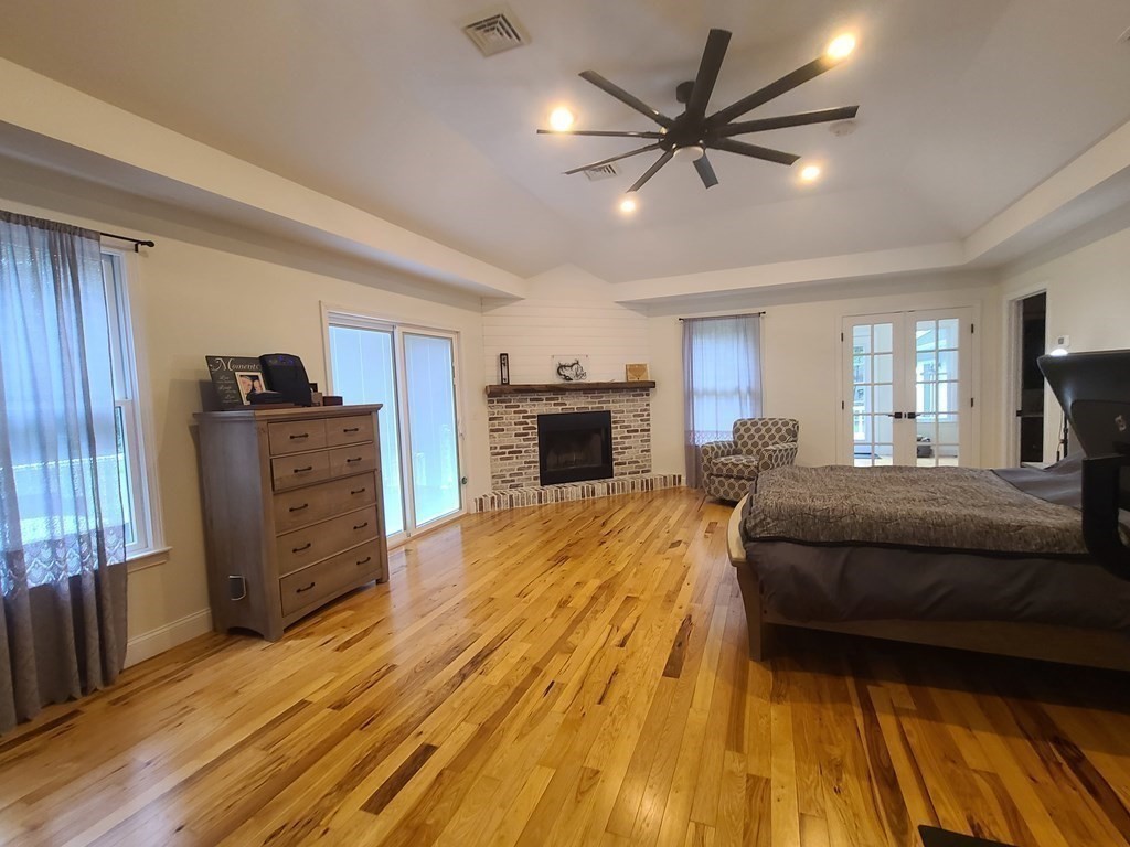 123 Boston Road Palmer, MA 01069 - Photo 16 of 33 a spacious bedroom with a bed and wooden floor
