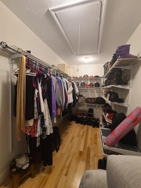 123 Boston Road Palmer, MA 01069 - Photo 17 of 33 a view of walk in closet with clothes and shoes
