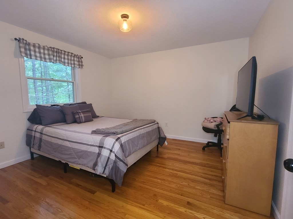 123 Boston Road Palmer, MA 01069 - Photo 23 of 33 a bedroom with a bed and a desk
