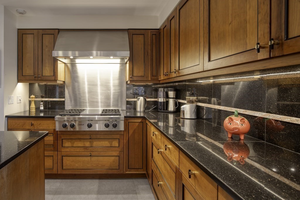 37 Beverly Road Arlington, MA 02474 - Photo 15 of 42 a kitchen with stainless steel appliances granite countertop a sink stove and cabinets