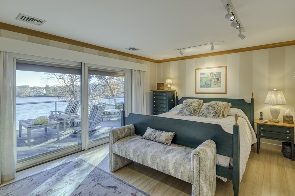 37 Beverly Road Arlington, MA 02474 - Photo 17 of 42 a bedroom with a bed and wooden floor